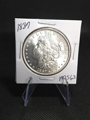 希少な 1887 年モルガン シルバー ダラー ? ミント 63 ? 素晴らしい光沢と鋭い打痕!