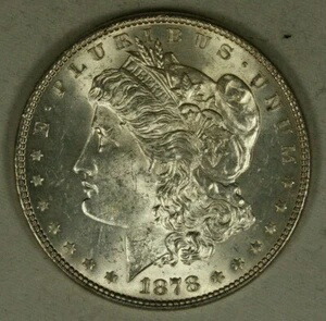 1878-7TF モルガン銀貨 1ドル。非常に状態の良い未使用品。7枚テールフェザードル。