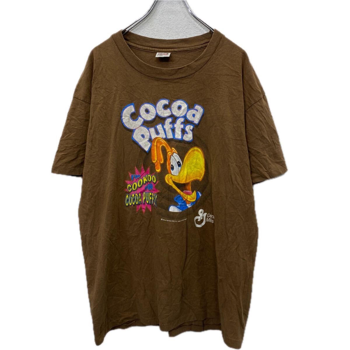【中古】【古着】 anvil 半袖 プリントTシャツ XL ブラウン アンビル USA製 90's～ ココアパフ ジェネラルミルズ 古着卸 アメリカ仕入 a708-5259