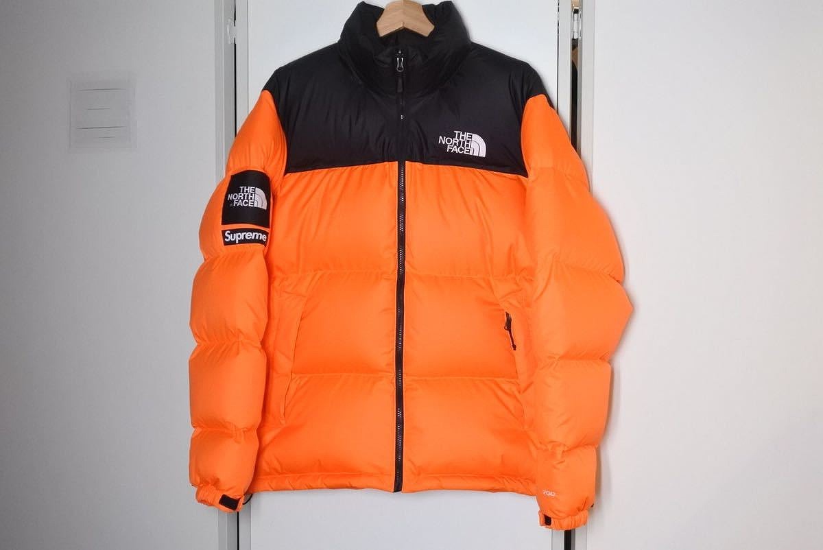 supreme north face orange